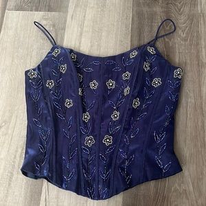 Navy blue corset size small. Has pretty bead flower designs.